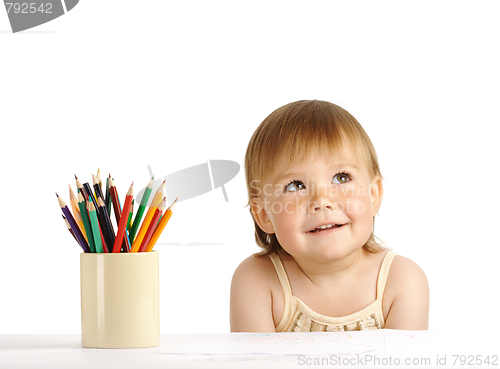 Image of Child with bunch of color crayons