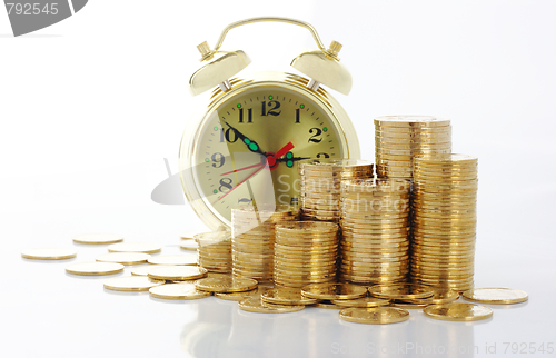 Image of Time is money - clock dial and golden coins