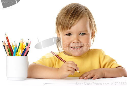 Image of Cute child draw with crayons and smile