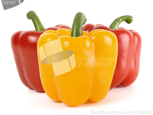 Image of Three bell peppers: one yellow and two red behind