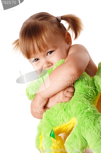 Image of Cute girl embracing her soft toy