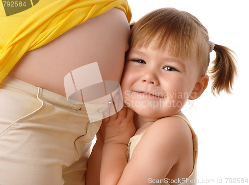 Image of Happy daughter embrace her pregnant mother