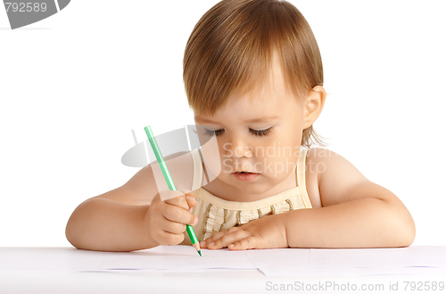 Image of Child draw with green crayon