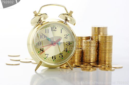 Image of Time is money - clock dial and golden coins