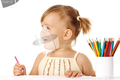 Image of Happy child play with crayons and smile
