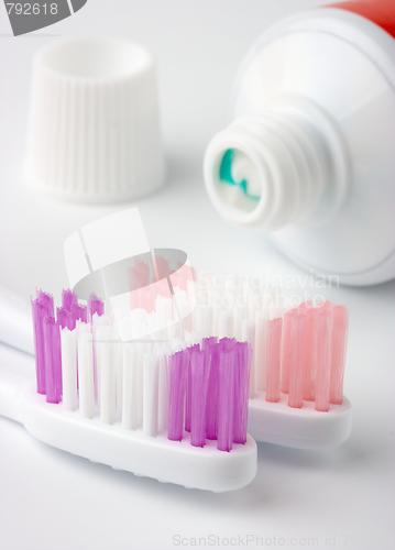 Image of Two toothbrushes and toothpaste