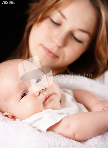 Image of Mother and child, focus on child
