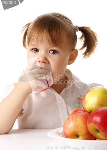 Image of Child eats red apple