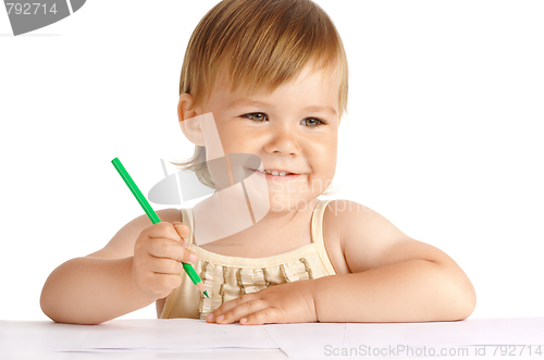 Image of Happy child with green crayon