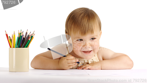 Image of Happy child draw with blue crayon