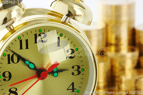 Image of Time is money - clock dial and golden coins