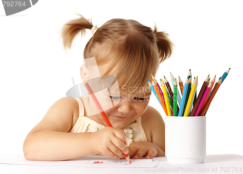 Image of Happy child play with color pencils and smile