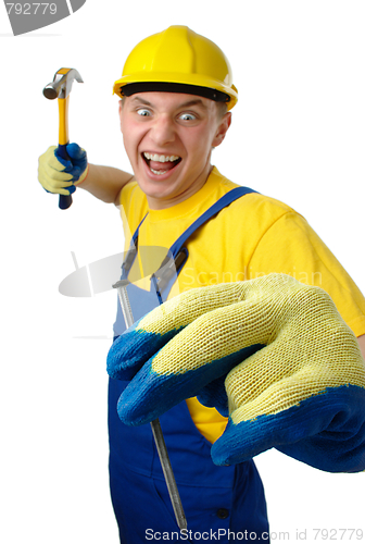 Image of Young worker furiously hammering a nail