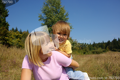 Image of Mother and child play outdoors