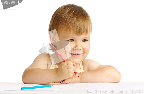 Image of Happy child smile and draw with red crayon