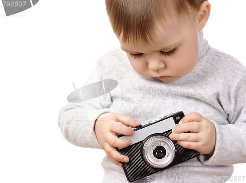 Image of Cute child play with photocamera