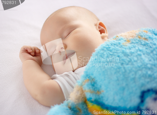 Image of Cute child is sleeping in bed