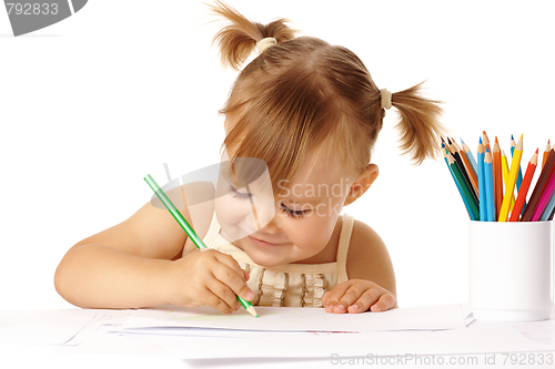 Image of Cute child draw with color pencils and smile