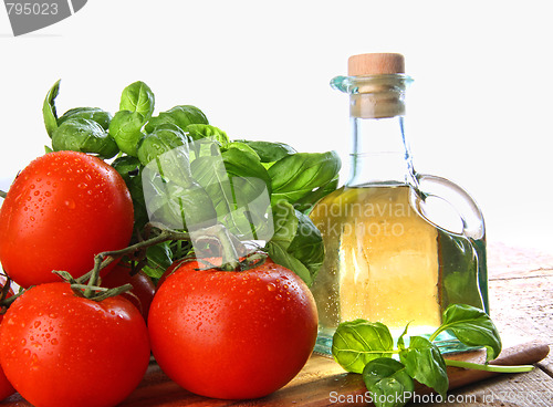Image of Tomatoes with fresh basil and olive oil