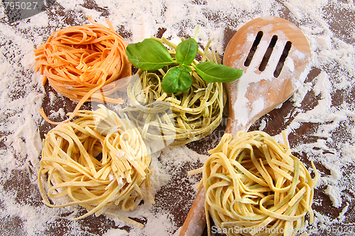 Image of Uncooked italian pasta in three colors