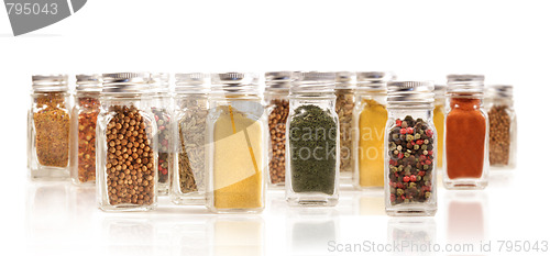 Image of Assorted spice bottles isolated on white