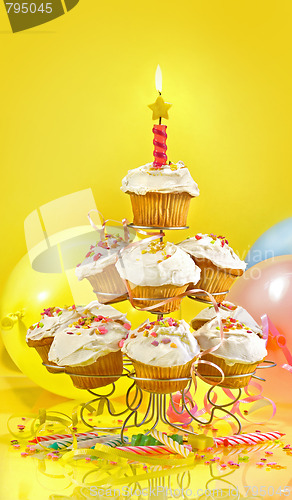 Image of Lots of cupcakes on yellow background