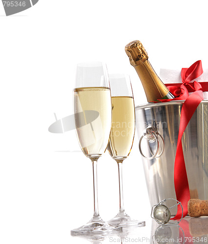 Image of Glasses of champagne with red ribbon gift