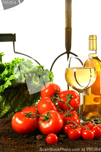 Image of Fresh tomatoes, lettuce and wine