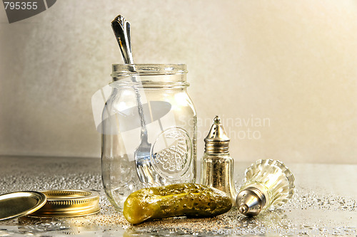 Image of Pickle with a jar and antique salt and pepper shakers