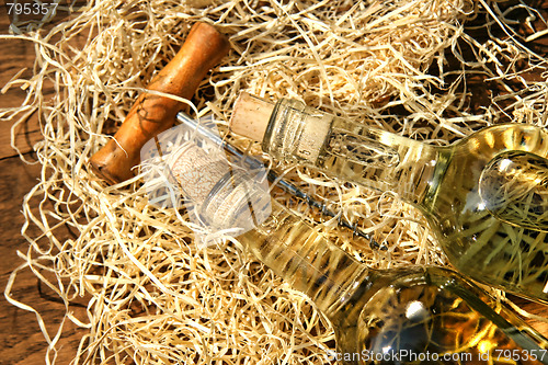 Image of Bottles of wine  with cork screw