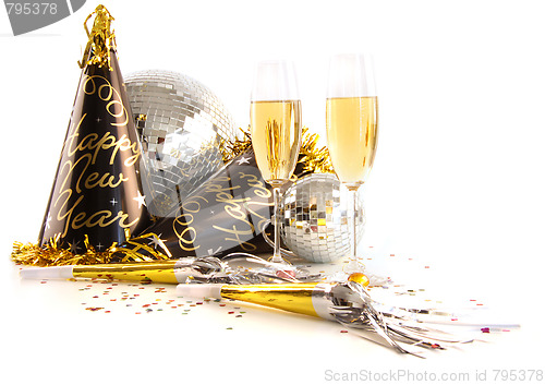 Image of Champagne glasses with festive party hats on white 