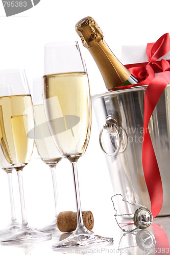 Image of Glasses with Champagne in ice bucket and gift