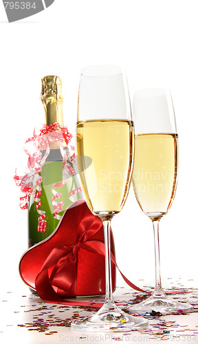 Image of Glasses of champagne with red ribbon heart