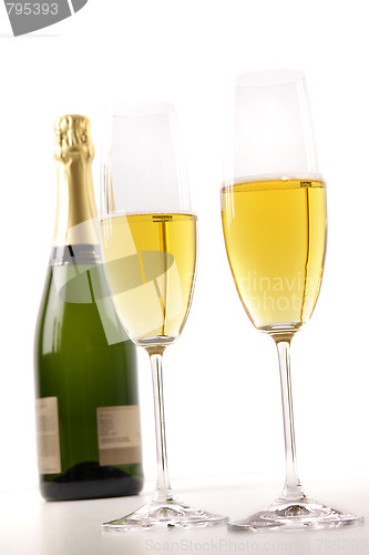 Image of Champagne glasses with bottle on white 