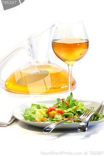 Image of Plate of salad and wine glass