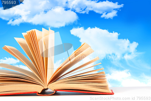 Image of Open book against a blue sky