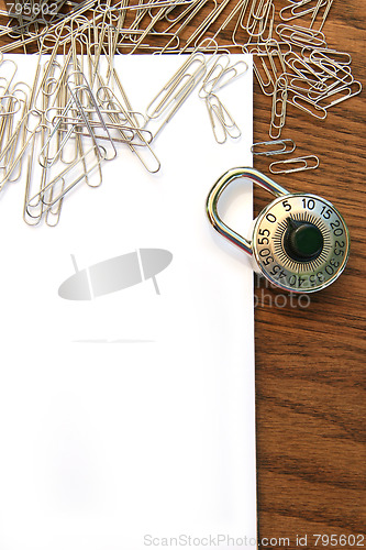 Image of White paper with clips and school lock 