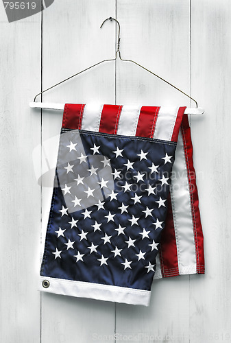 Image of American flag folded with clothes hanger