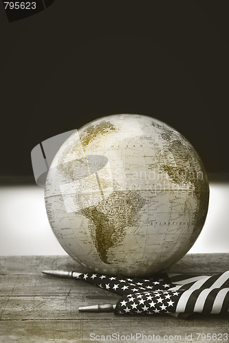 Image of Globe and flag on school desk