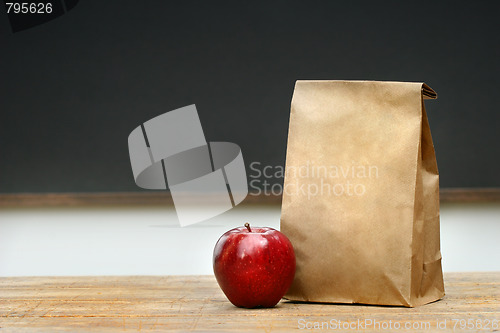 Image of Paper lunch bag on desk 