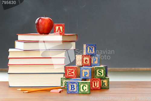 Image of Pile of books with wooden blocks