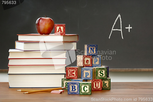 Image of Pile of books with wooden blocks