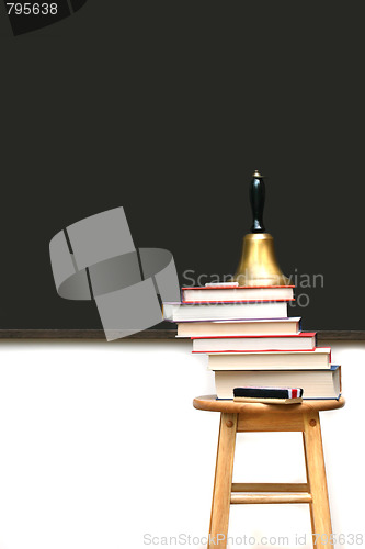 Image of School books on stool