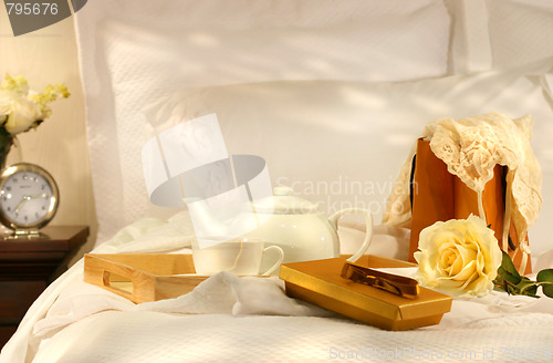 Image of Tea in bed with chocolates