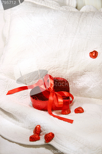 Image of Box of chocolates with red ribbon 