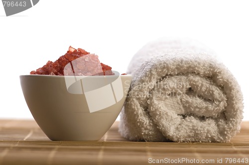 Image of bath salt and towel. red and white