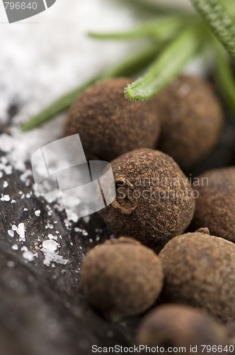 Image of allspice with fresh rosemary