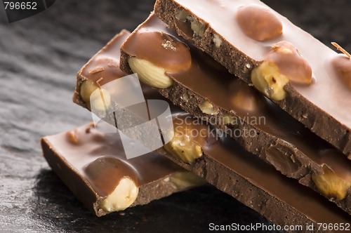 Image of Pile of broken chocolate with nuts