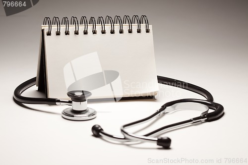 Image of Blank Spiral Note Pad and Black Stethoscope