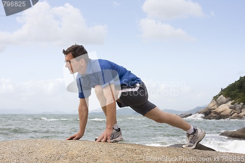 Image of Jogger doing fitness exercises